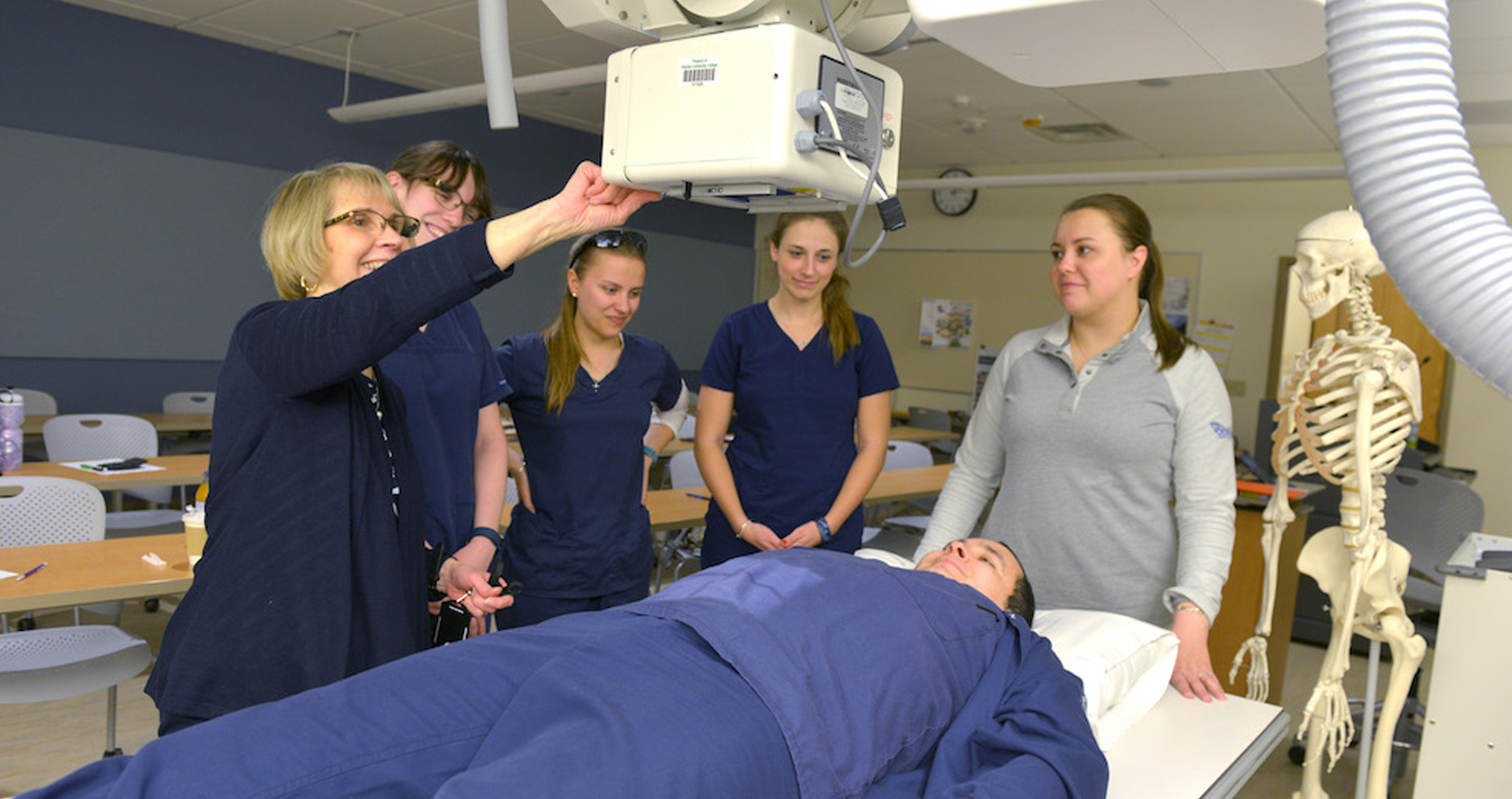 Rad tech students use an X-ray machine